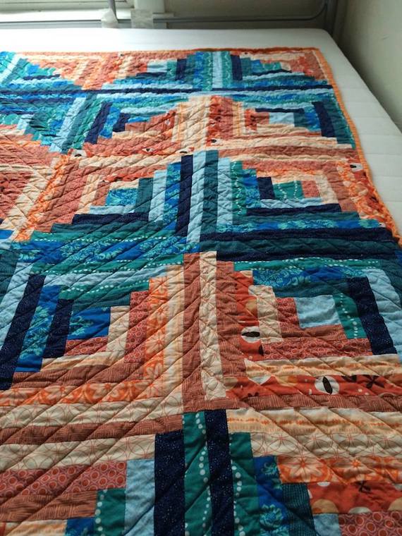 Orange and blue chevron log cabin quilt